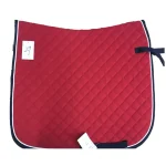 Red quilted horse saddle pad with black trim and ties
