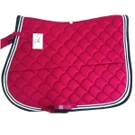 Bright red horse saddle pad with quilted design and navy trim.