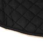 Black quilted horse saddle pad with beige lining and stitched edges